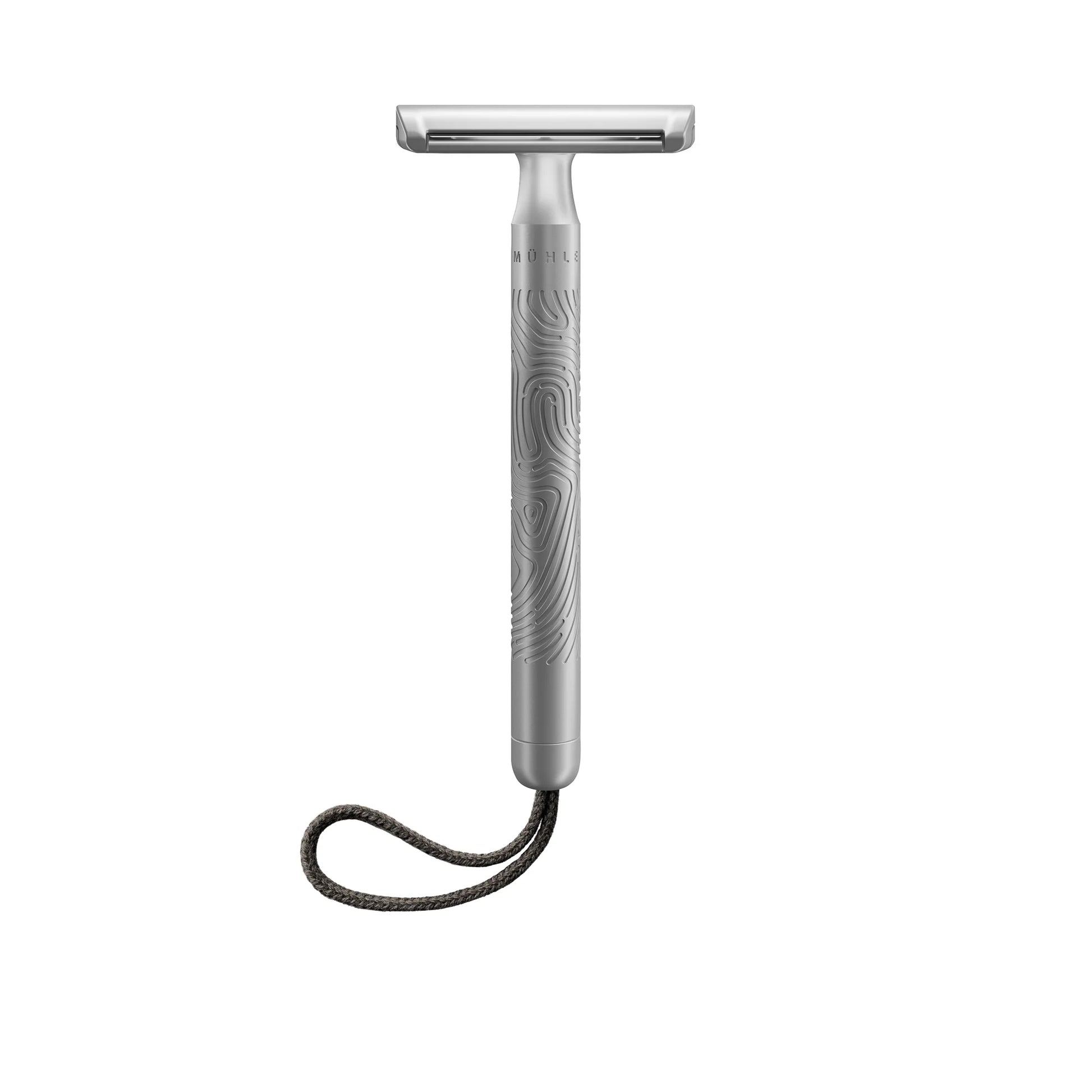 The Mühle Companion Safety Razor is displayed against a white background, showcasing its textured handle, sleek silver PVD-coated finish, and a black braided loop attached at the bottom.