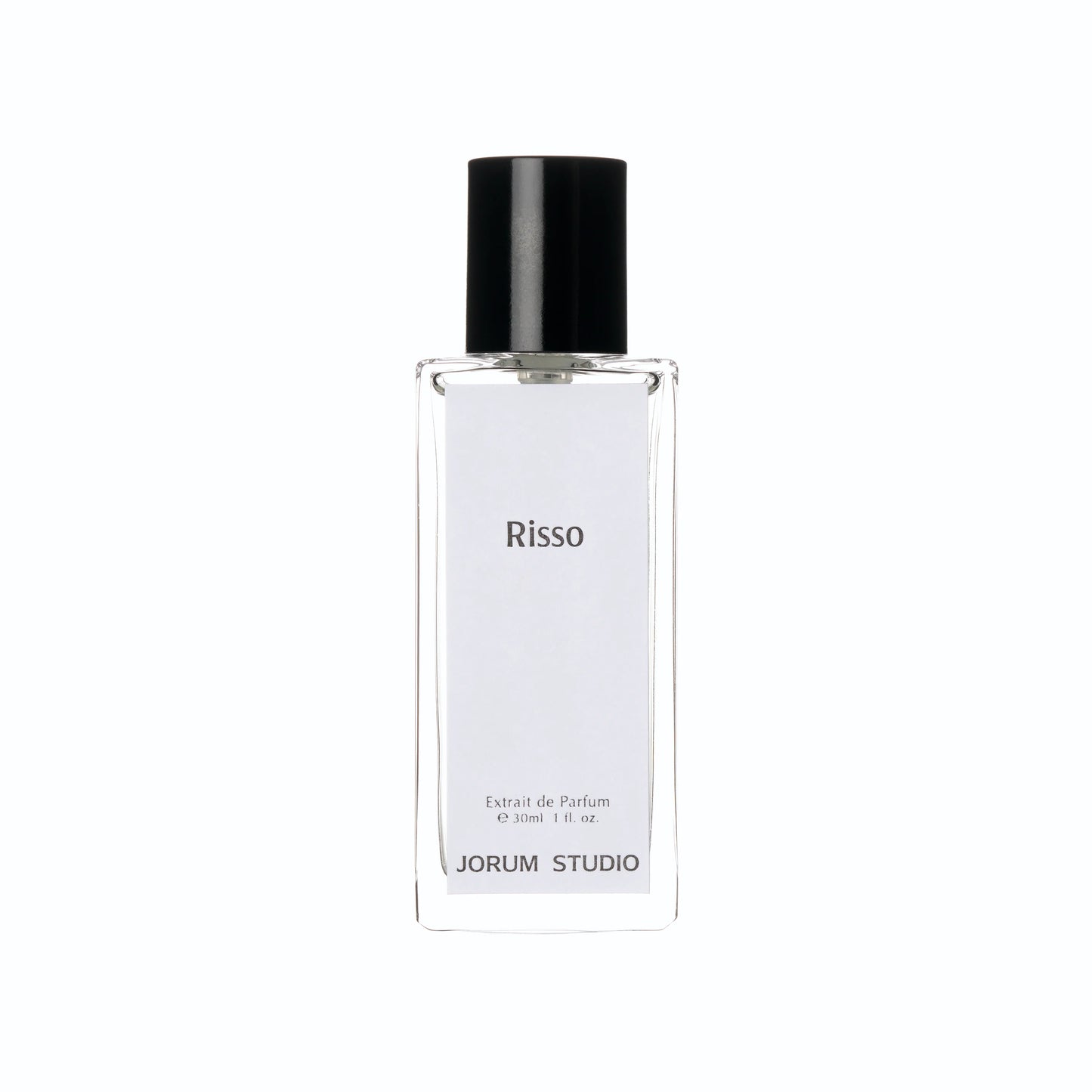 A clear glass perfume bottle with a black cap, featuring a label inscribed with “Risso,” “Extrait de Parfum,” and “JORUM STUDIO.” This elegant 30ml (1 fl. oz) bottle contains the Jorum Studio Risso ExDP fragrance—a sophisticated luxury scent from the independent fragrance house, Jorum Studio.