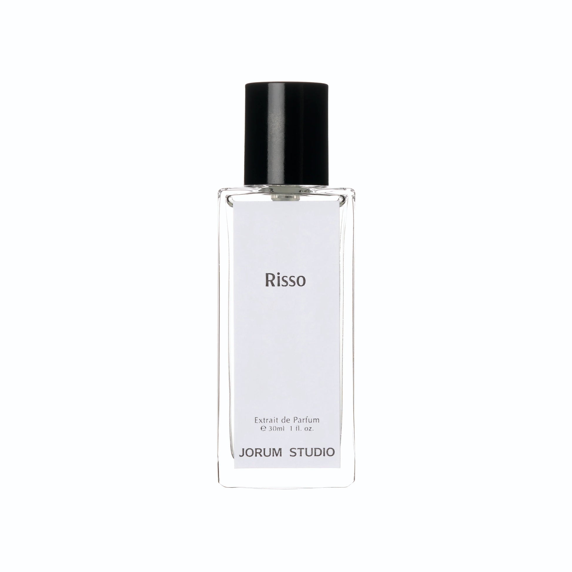 A clear glass perfume bottle with a black cap, featuring a label inscribed with “Risso,” “Extrait de Parfum,” and “JORUM STUDIO.” This elegant 30ml (1 fl. oz) bottle contains the Jorum Studio Risso ExDP fragrance—a sophisticated luxury scent from the independent fragrance house, Jorum Studio.