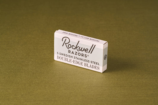 Rockwell Razors Double Edge Safety Razor Blades, Swedish stainless steel, 5-pack, on an olive-green surface, ideal for sensitive skin and moderate hair.