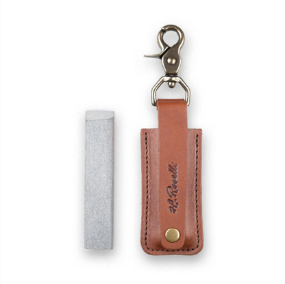 Roselli Sharpening Stone with Leather Sheath and Trigger Snap, featuring a compact whetstone and brown leather holster for easy carrying on a belt or keychain.