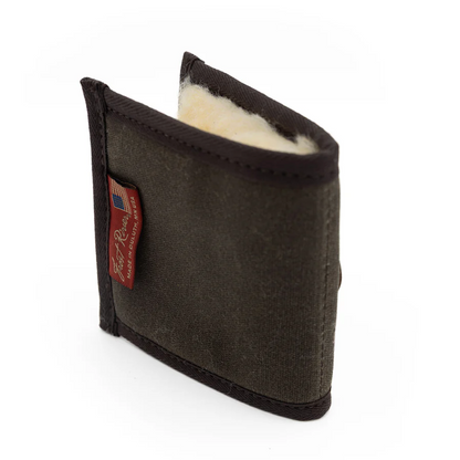 Frost River Bifold Fly Wallet: A canvas-and-wool lined cheek pad for rifle buttstocks, providing cushioning and insulation with waxed canvas, leather, and sheepskin craftsmanship.