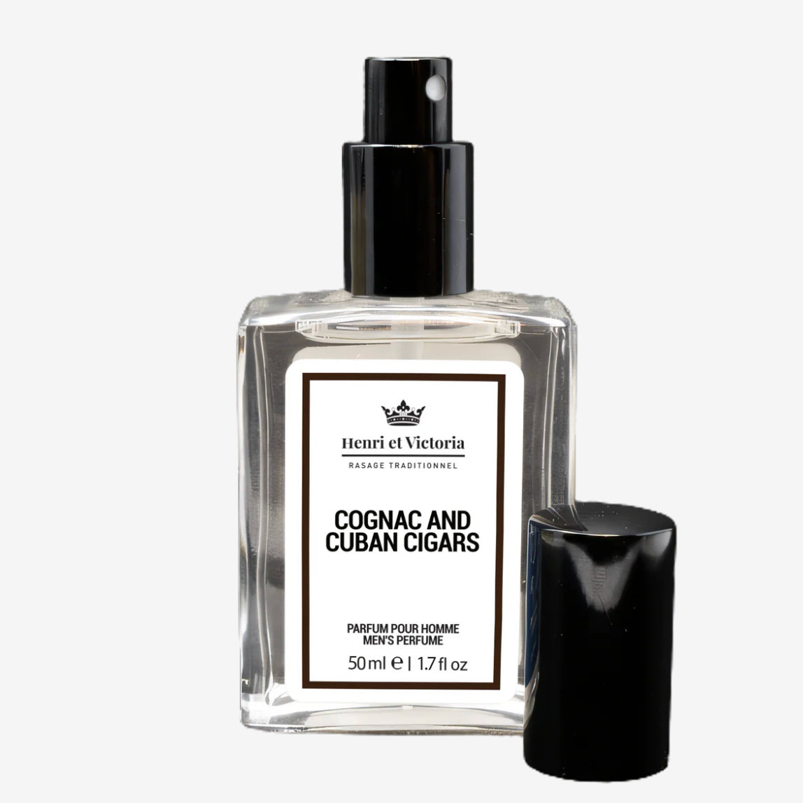 Perfume bottle labeled 'Cognac and Cuban Cigars' by Henri et Victoria on a white background