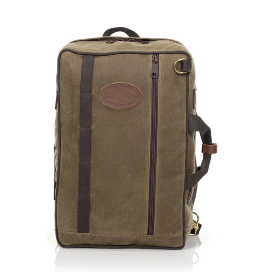 The Frost River Voyageur Backpack is a rectangular olive green waxed canvas bag featuring brown straps, a side handle, leather accents, a front zipper pocket, and a distinctive rounded patch on the front. Reminiscent of classic Frost River durability, this backpack stands upright against a white background.