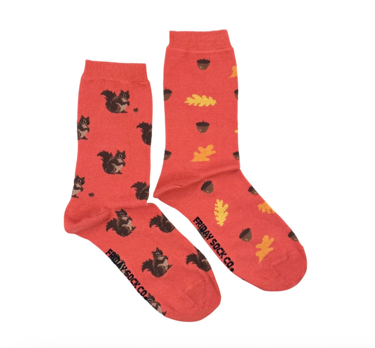 Friday Sock Co. Squirrel and Acorn Womens crew socks in red, featuring a pattern of brown squirrels on one sock and yellow leaves and brown acorns on the other.