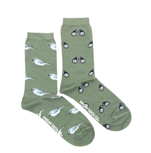 A pair of ethically produced olive green Friday Sock Co. Bird Watching socks, with one featuring a bird pattern and the other featuring a binoculars pattern.