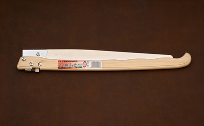A Gyokucho Megumi Folding Saw 330mm with a long metal blade and a light-colored wooden handle, shown in the closed position.
