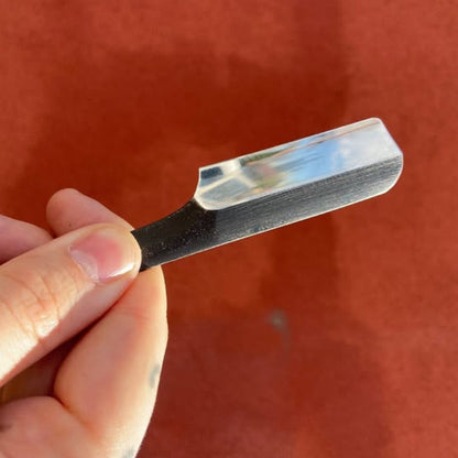 Takami Kamisori Japanese Straight Razor Western Grind, featuring a sleek design with a durable, hand-forged steel blade and ergonomic handle for precision shaving.
