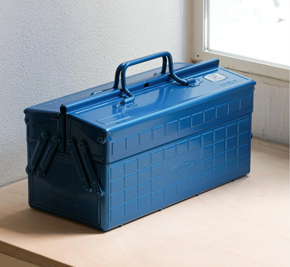 Toyo Cantilever Steel Toolbox - ST-350, closed on a workbench, showcasing its compact design and twin handles, ideal for organized, customizable storage.