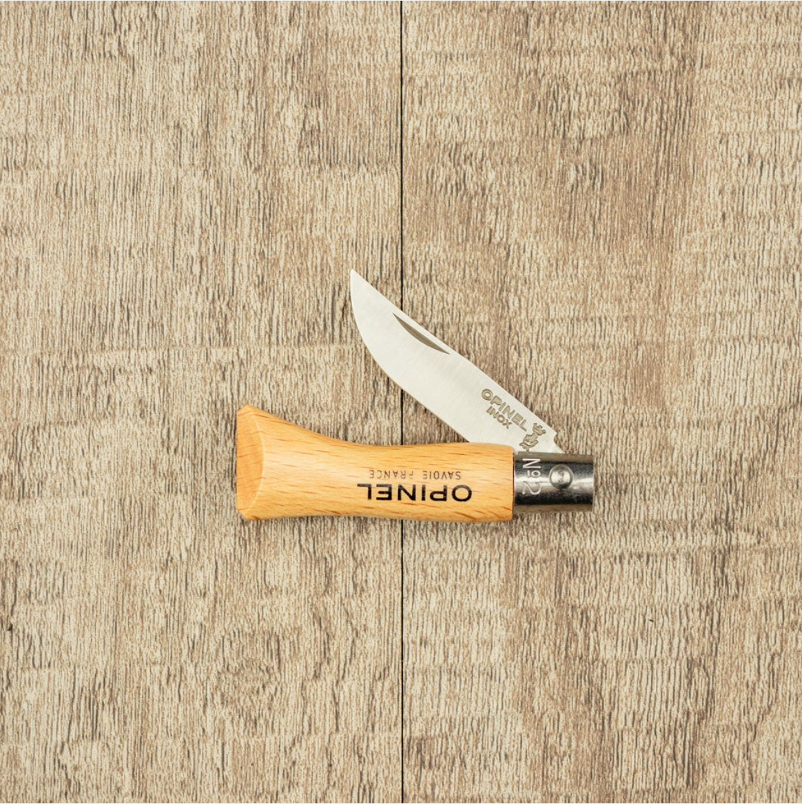 Opinel knife with wooden handle on a wooden surface