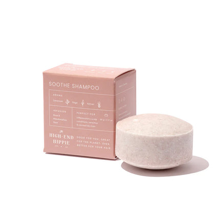 The High End Hippie Soothe Shampoo Bar, designed for normal hair, sits beside its soft pink packaging, highlighting geranium, sage, and vetiver scent with rose infusion.