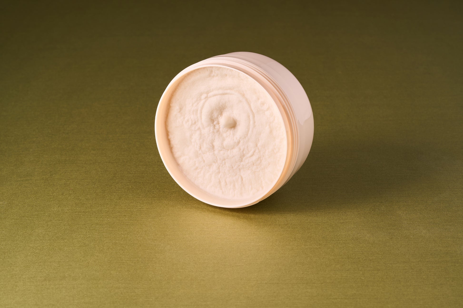 Taylor of Old Bond Street Sandalwood Shaving Cream, a 150g jar, with a creamy, textured consistency, ideal for quick lathering.