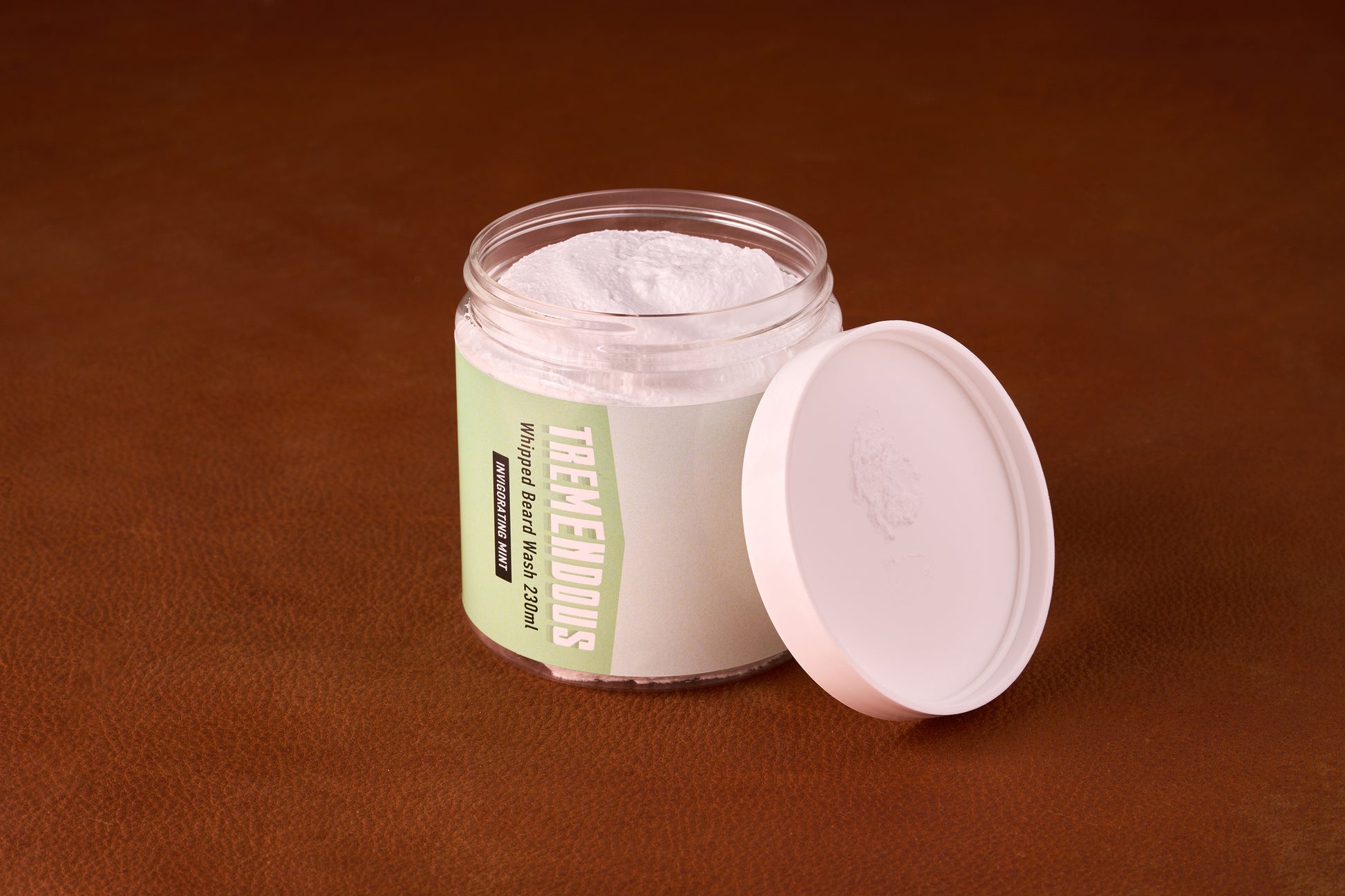 Tremendous PH Balanced Whipped Beard Wash in a clear jar with white lid, featuring Invigorating Mint scent; crafted for gentle, hydrating beard care.