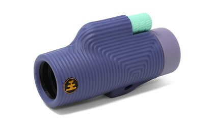 The NOCS Provisions Zoom Tube 8x32 Monocular is a compact optical tool with a purple body, textured wavy surface, light green grip on top, and a yellow circular logo near the lens. Water resistant and crafted for convenience, it is displayed against a white background.