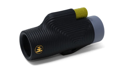 The NOCS Provisions Zoom Tube 8x32 Monocular is a compact optical tool in black, featuring a textured grip, distinctive yellow focus knob on top, gray eyepiece, and a round gold emblem near the lens. Water resistant and designed for convenience, it provides a wide field of view for enhanced clarity.