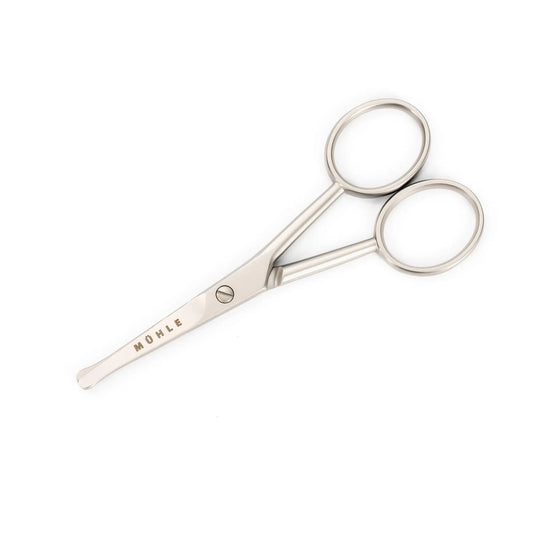 A Mühle Scissor for Beard, Nose & Hair made of stainless steel, featuring an ergonomic design with rounded tips and two finger holes, lies on a white background. The word “MÜHLE” is engraved on one blade.