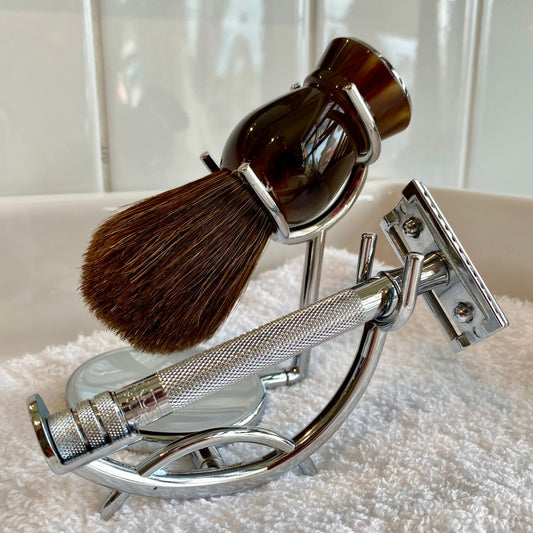 Kent's Better Shaving Kit features a metal safety razor and horse hair brush in a chrome stand, perfect for a premium, enduring shave setup.