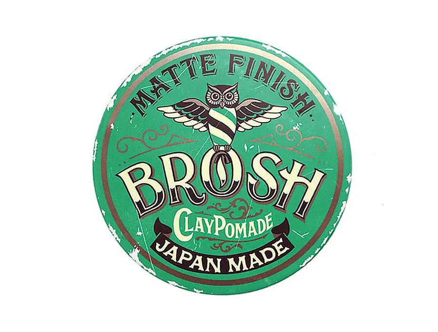 Round green container with 'Brosh Clay Pomade' branding on a white background