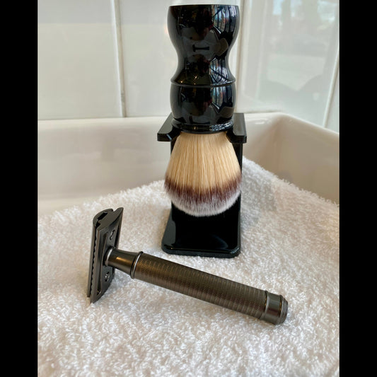 Kent's Good Shaving Kit featuring a metal-handled safety razor and black stand-mounted shaving brush, perfect for beginners in traditional wet shaving.