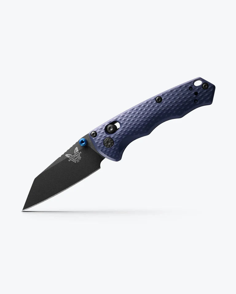 A Benchmade Full Immunity folding pocket knife with a textured blue handle and a black M4 steel blade, displayed against a plain white background.