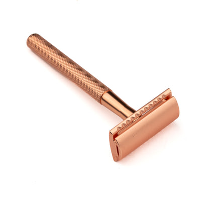 Less Than Perfect Hoxton Shave Co. Rose Gold DE Safety Razor with textured handle, ideal for close, eco-friendly shaving, featuring a robust nickel alloy construction.