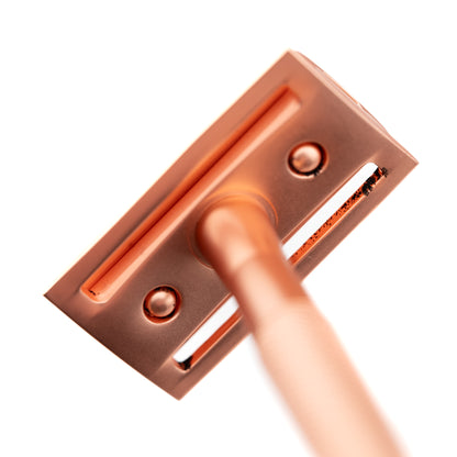 Less Than Perfect Hoxton Shave Co. Rose Gold DE Safety Razor, showcasing a textured handle and robust metal design, ideal for eco-friendly, close shaves.