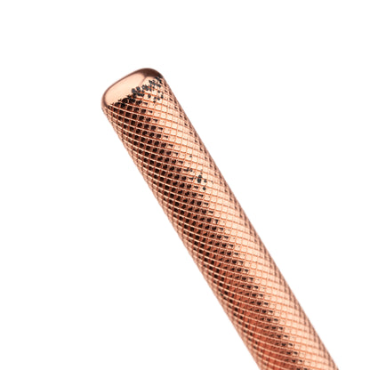 Close-up of the Less Than Perfect Hoxton Shave Co. Rose Gold DE Safety Razor handle, featuring a textured, copper-colored finish, ideal for wet shaving.