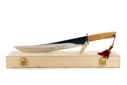 Maserin Sommelier Sabre 11 with a polished blade and light-wood handle, displayed on a wooden block, ideal for celebratory champagne sabrage.
