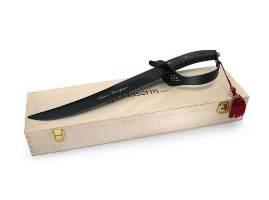 Black knife with leather sheath in a wooden box on a white background