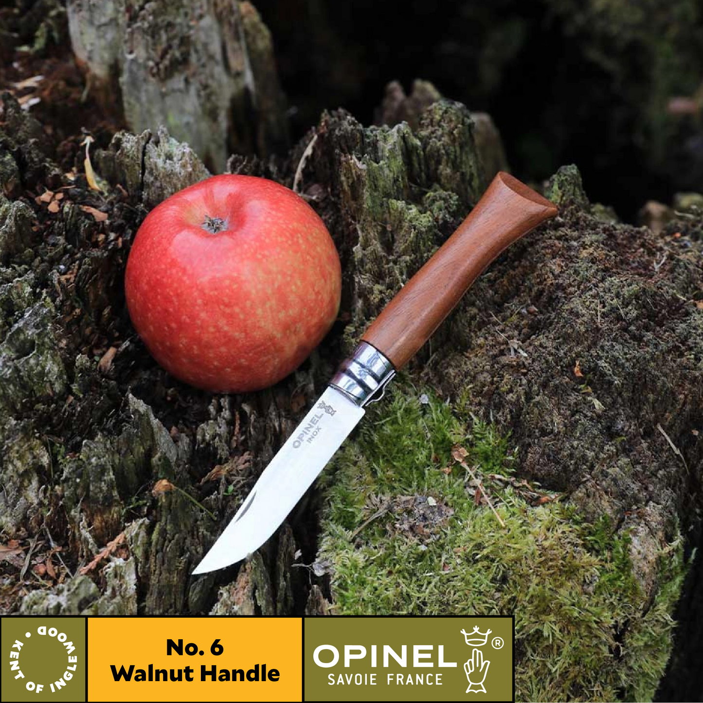 Opinel knife with walnut handle next to an apple on a natural background