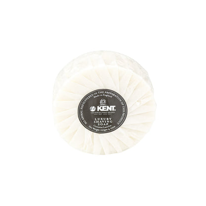 Kent of England Shaving Soap wrapped in pleated paper, labeled with Luxury Shaving Soap and Made in England, highlighting its lanolin content for a superior shave.