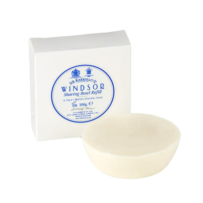 D.R. Harris Windsor Shaving Soap refill puck next to its white packaging, embodying classic luxury and sustainability for an exceptional shave experience.