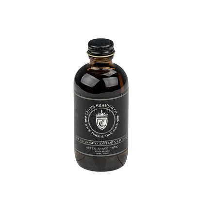 Crown Shaving Co. Aftershave Tonic in 120ml amber-glass bottle, labeled “For Vagabonds, Gentlemen & Ruffians,” featuring a classic bay rum, anise, and leather scent.