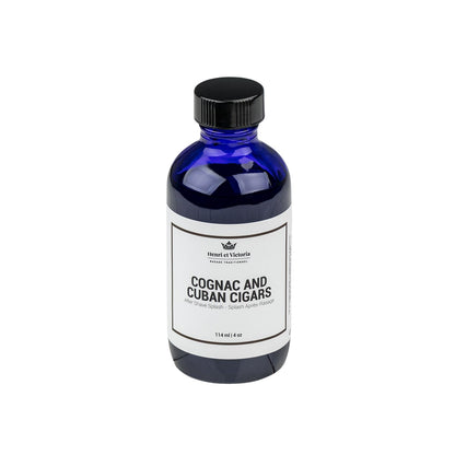 Henri et Victoria - Cognac and Cuban Cigars Aftershave Splash in cobalt-blue bottle with black lid. Invigorating post-shave, offering notes of smoke, leather, and cognac. 