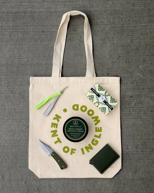 Kent of Inglewood Canvas Tote with everyday-carry shaving essentials: Taylor of Old Bond Street shaving cream, straight razor, pocket knife, leather wallet, and Castelbel item.