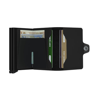 Secrid Wallets Twinwallet: Black wallet-style card holder with quick-eject mechanism, money clip for Euros, and snap-button flap with additional card slots. Hand-made in Holland.