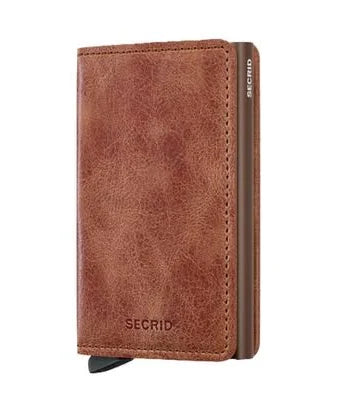 Secrid Wallets Slimwallet - Vintage: A sleek, brown leather cardholder with RFID protection and easy-access lever, designed for style and practicality. Made in Holland, ideal for cash and cards.