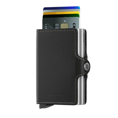 Secrid Wallets Twinwallet, a sleek black leather wallet, features an aluminum chassis for 2-6 cards, cash, and RFID protection with a stylish card lever.