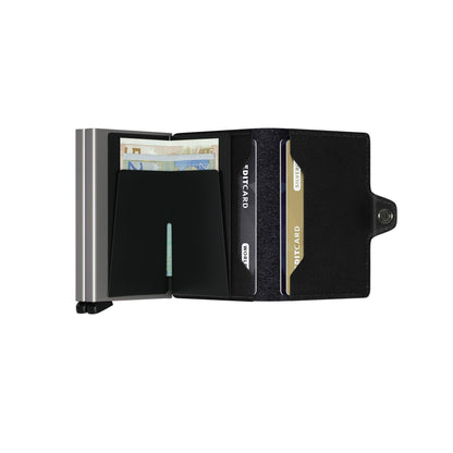 Secrid Wallets Twinwallet, featuring a slim design with a metal RFID compartment for cash and a leather flap for 10-12 cards, handmade in Holland.