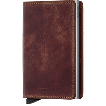 Secrid Wallets Slimwallet - Vintage, a compact brown leather cardholder with RFID blocking and signature lever for easy card access, featuring a silver metal chassis.