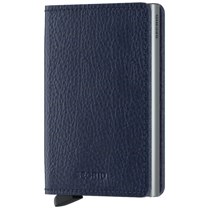 Secrid Wallets Slimwallet - Veg Tanned: Slim navy-blue leather wallet featuring a card-protecting aluminum mechanism, fanning cards for easy access; holds cards, cash, and more.