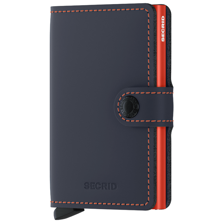 Secrid Wallets Miniwallet - Matte: Compact navy leather wallet with orange stitching, snap closure, and red aluminum card-holder. Holds cards, cash; RFID blocking.