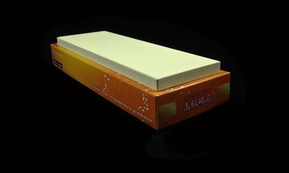Naniwa Specialty/Super Stone 8000 210x70x10mm, a fine-grit sharpening stone on its box, ideal for refining blades between sharpening stages.