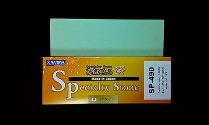 Naniwa Specialty/Super Stone 10000 210x70x10mm, a pale-green sharpening stone, atop its branded box, ideal for achieving a perfect, long-lasting shave.