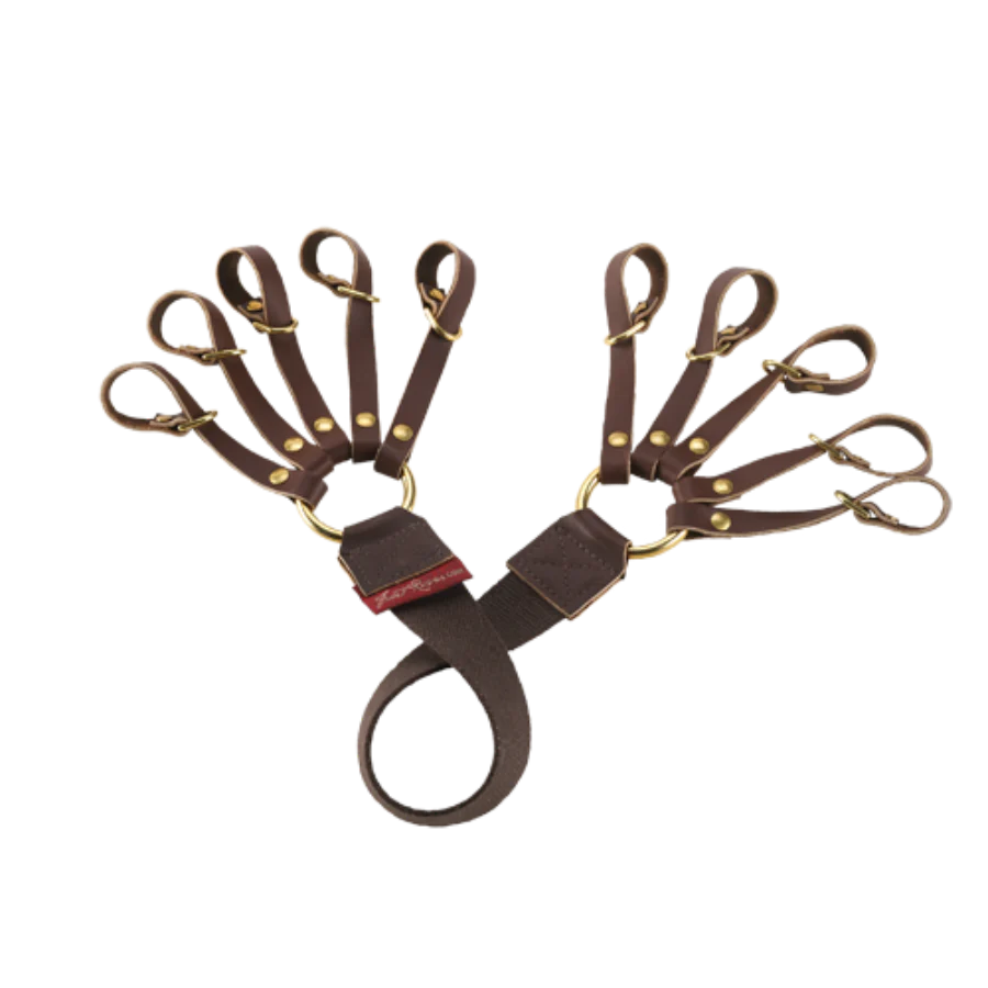 Frost River Game Holder with brass rings and leather straps for holding up to ten keys, featuring a durable leather/nylon wrist loop for easy carrying.