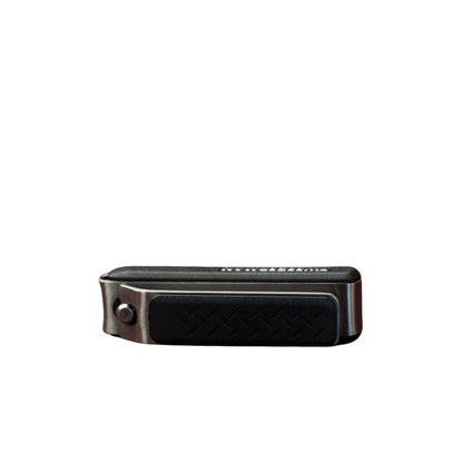 Tweezerman G.E.A.R. Cupcatch Nail Clipper, a compact multi-tool with textured handles, designed to catch clippings for a mess-free nail trimming experience.