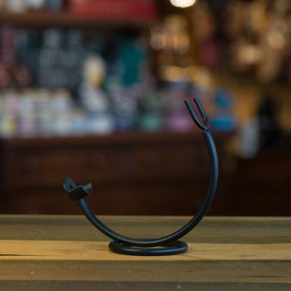 Curved Stand for Straight Razors: A sleek, chrome-plated metal stand for elegantly displaying and safely storing your straight razor, enhancing any grooming space.
