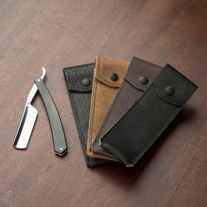 Horace & Jasper Leather Straight Razor Case displayed with assorted leather pouches, highlighting craftsmanship and elegance, perfect for safely storing a straight razor during travel.