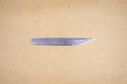 Kiridashi Japanese Craft Knife, a single-edged blade with hammered texture, ideal for precise cuts in woodworking and crafts, embodying durability and precision.