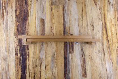 Knifewear Sharpening Sink Bridge on wood surface, featuring adjustable bamboo slats and a wing-nut for securing sharpening stones, enhancing stability and safety during use.